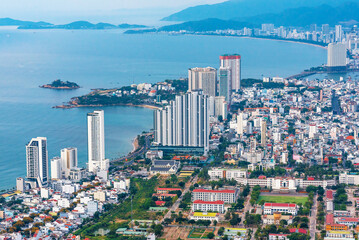 Nha Trang city in Vietnam aerial top view. Skyscrapers by sea in a resort town in Asia