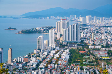Nha Trang city with skyscrapers and sea in Vietnam. Panoramic aerial top view of Nha Trang town of...