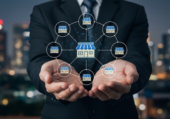 Franchising concept: Man holding digital network of store icons against a blurred cityscape backdrop.