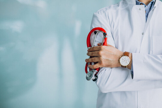 Young handsome physician in a medical robe with stethoscope background image for your project