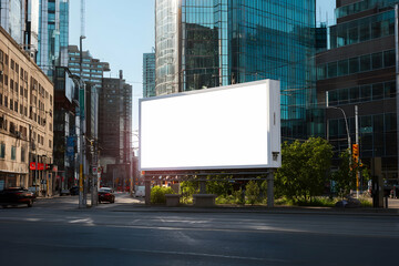 A blank billboard stands prominently on a city street surrounded by tall buildings on a sunny day time akhtar