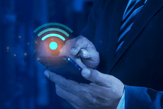 Business people connect WiFi technology. Using smartphone with wifi icon, business communication social network concept. Wifi internet access concept