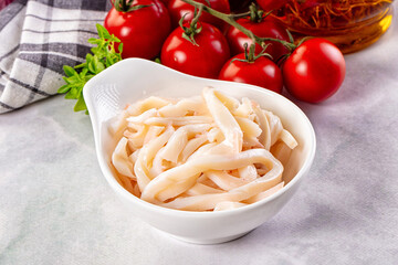 Canned marinated squid rings heap
