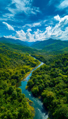 Breathtaking view of lush green mountains and winding river under a vibrant blue sky