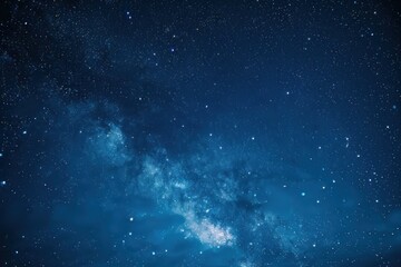 Naklejka premium Serene view of night sky with stars, cosmic dust and blue atmosphere