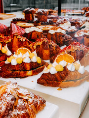 Colorful display of various pastries in a bakery showcasing artistic dessert designs and flavors