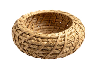 Woven straw basket on black background