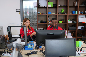 Engineers are working at 3D printing workshop.