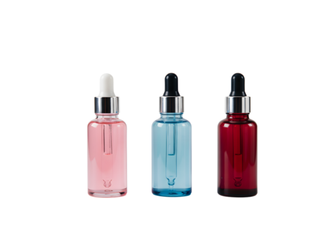 Set of elegant glass dropper bottles with golden lids and colorful serums — perfect for skincare, essential oils, cosmetics, and beauty product branding. Isolated on a transparent background. - Powered by Adobe