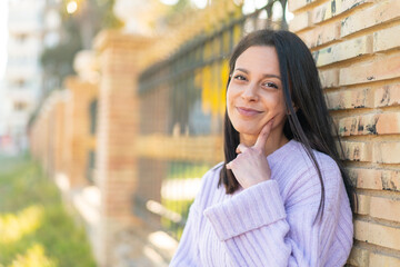 Young woman at outdoors thinking
