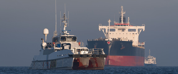 MARITIME TRANSPORT - Offshore tug/supply ship and bulk carrier sailing to sea port