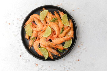 Shrimp and lime arranged in white plate for gourmet lunch or elegant seafood concept