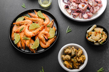 Flatlay of shrimp and octopus salad with olives for cooking blog or seafood concept