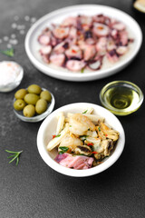 Black bowl with shrimp salad and seafood mix for tapas or gastro bar concept