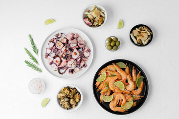 Seafood assortment with shrimp and octopus on white table for buffet, catering or menu concept