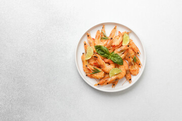 Shrimp with fresh basil on ceramic plate for Italian seafood or healthy meal concept