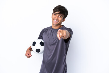 Handsome young football player man isolated on white background pointing front with happy expression
