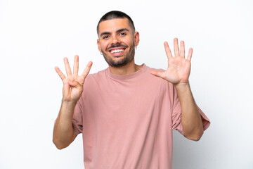 Naklejka premium Young caucasian man isolated on white background counting nine with fingers
