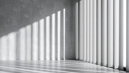 Obraz premium Sunlight streams through vertical blinds casting shadows on a textured wall and floor in an empty room.