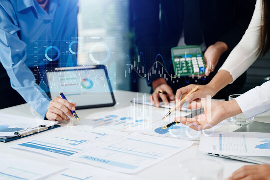 Team colleagues wear formal attire to work together to optimize business processes by using new technologies. high tech hologram