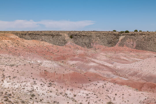 Tiponi Point, Petrified Forest National Park, Arizona. Chinle Formation, Petrified Forest Member(Upper Triassic). reddish mudstones and brown sandstone.  basanite flow / volcanic rocks