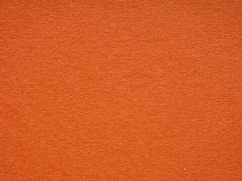 Fiery orange paper texture with a subtle fibrous detail, conveying warmth and creative vibrancy