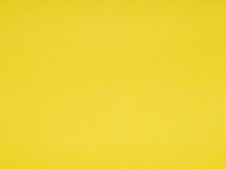 A vibrant sunshine yellow paper background awakens creativity with its bright and cheerful hue