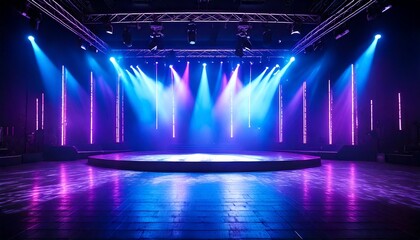 A stage illuminated with vibrant purple and blue lights, creating a dynamic and energetic at.jpg