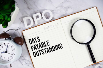 DPO - Days Payable Outstanding acronym on notepad, Business concept background