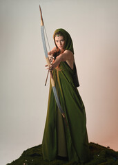  close up portrait of beautiful female model figure wearing green fantasy fae hooded cloak crown...