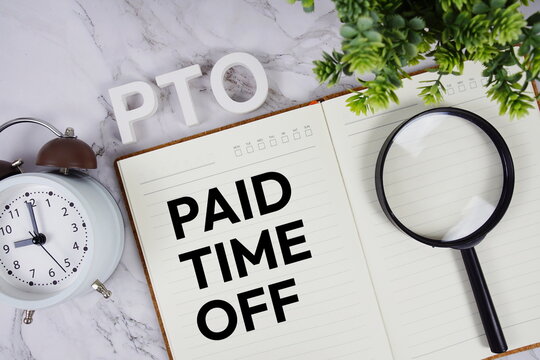 PTO - Paid Time Off acronym on notepad, Business concept background