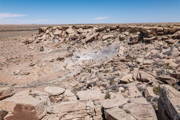 Newspaper Rock Petroglyphs Archeological District,  Petrified Forest National Park, Arizona. Desert varnish.  Chinle Formation, Blue Mesa Member. Mudstone with minor siltstone and sandstone.
