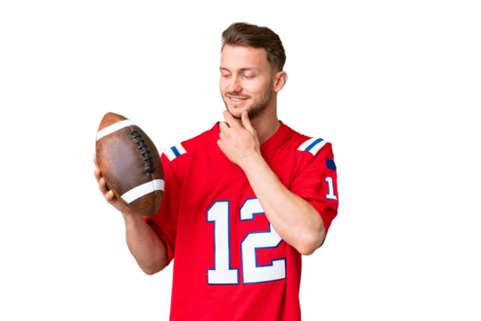 Young caucasian man playing rugby over isolated chroma key background looking to the side and smiling