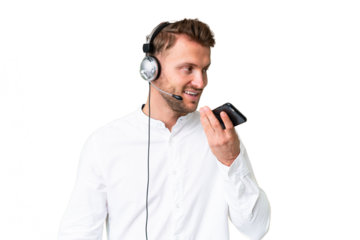 Telemarketer caucasian man working with a headset over isolated chroma key background keeping a conversation with the mobile phone with someone