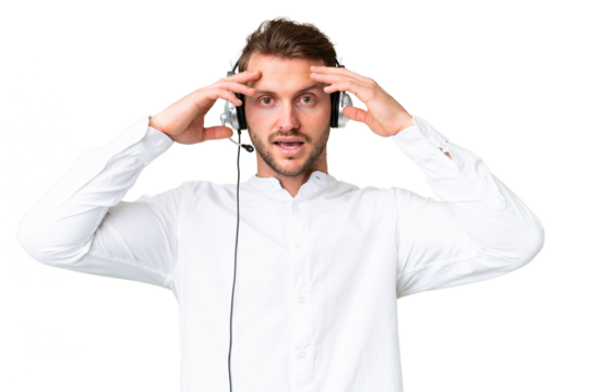 Telemarketer caucasian man working with a headset over isolated chroma key background with surprise expression