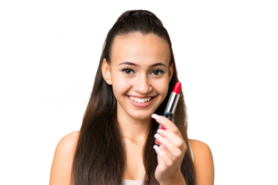Young Arabian woman over isolated chroma key background holding red lipstick and offering it
