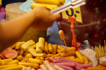 Deep-fried  hot dog for sale at street food in Thailand