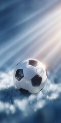 Fototapeta premium A classic soccer ball rests on a snowy field with dramatic sunlight streaming through the sky