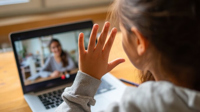 Hispanic teen girl school college student distance learning waving hand studying with online teacher on laptop screen. Elearning zoom video call, videoconference class with tutor. Over shoulder view.
