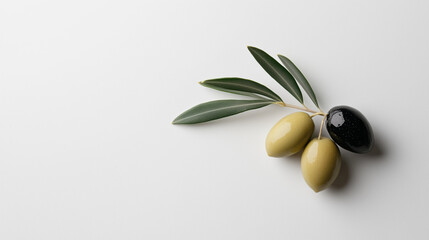Fresh olives with leaves arranged on a light background, showcasing natural colors and textures in a culinary setting