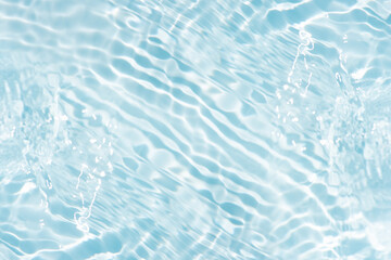 Blue water with ripples on the surface. Defocus blurred transparent blue colored clear calm water...
