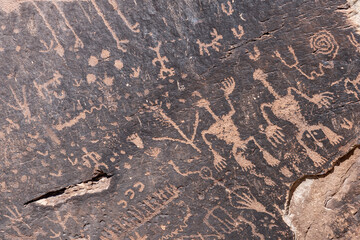Newspaper Rock Petroglyphs Archeological District, Petrified Forest National Park, Arizona. Desert varnish. Chinle Formation, Blue Mesa Member. Mudstone with minor siltstone and sandstone.