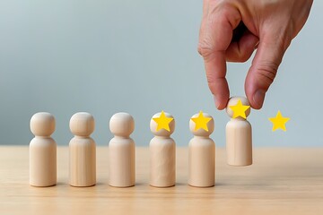 A hand places a wooden peg with a yellow star on its head representing a top rating next to other pegs with stars symbolizing customer satisfaction and positive feedback