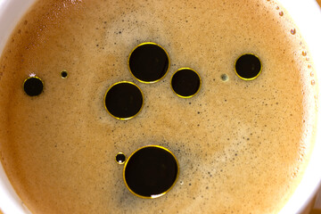 Morning Coffee Infused with Olive Oil for a Healthy, Energizing Start, macro, close up. 
