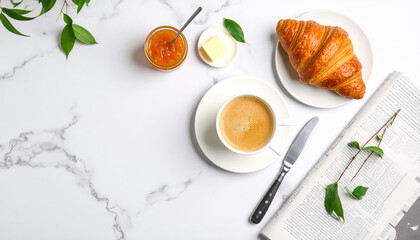Parisian breakfast flat lay with a fresh croissant, café au lait, and jam on a classic white...