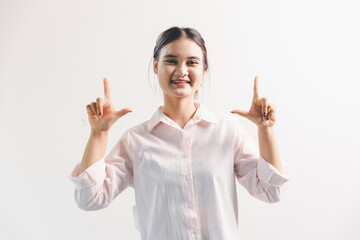 Asian woman rejoicing, looking happy, champion, fist pump gesture, standing over white background....