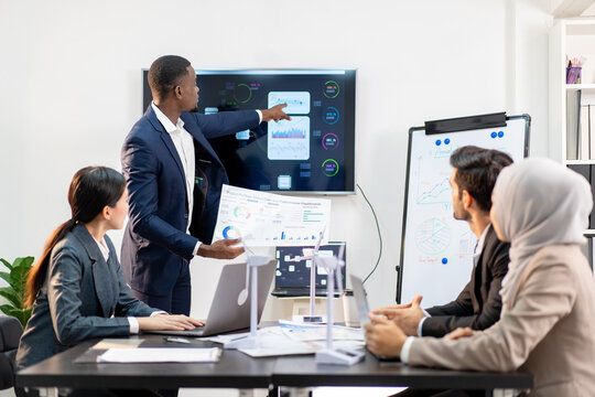 team of multiethnic colleague discuss budget performance planning, sharing idea for cost reduction, business people man woman diverse employee coworker in formal suit meeting in financial office