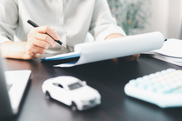Sale agent deal to agreement successful car loan contract with customer and sign agreement contract...