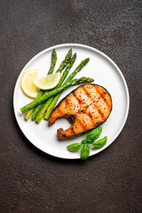 Grilled salmon steak with roasted green asparagus
