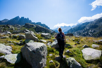 Fototapeta premium Young hiker woman in Vall de Boi, Aiguestortes and Sant Maurici National Park, Spain
